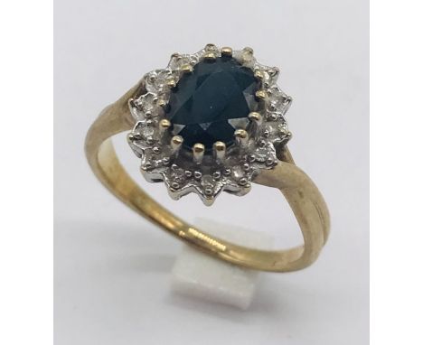 A diamond and sapphire cluster ring set in 9ct gold