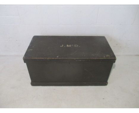 An antique pine trunk, with 'J. Mc. D' to top, length 84cm.