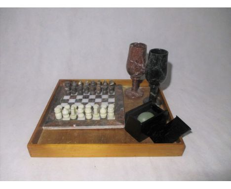 Two serpentine goblets, along with a serpentine chess set and board (complete) and an oriental jade egg.