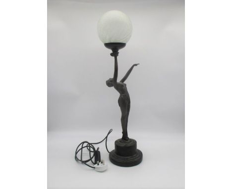 An Art Deco style lamp, in the form of a lady, standing.