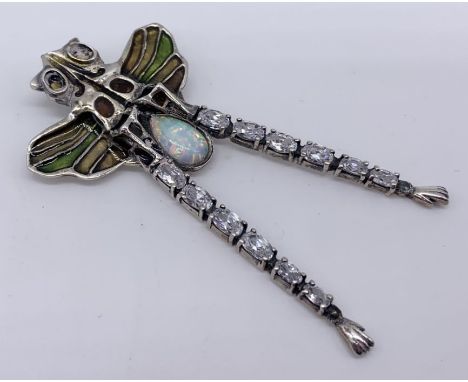 A large 925 silver dragonfly pendant set with an opal