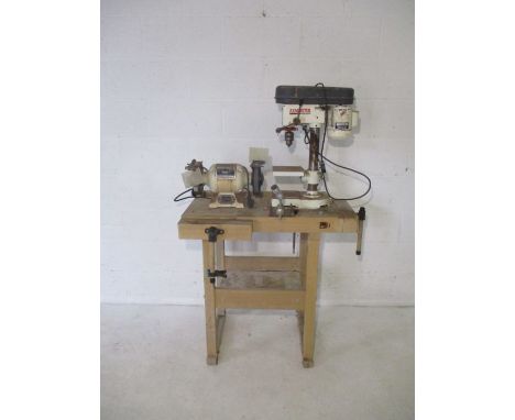 A vintage work bench, along with an Axminster Power Tools Centre power drill and bench grinder.