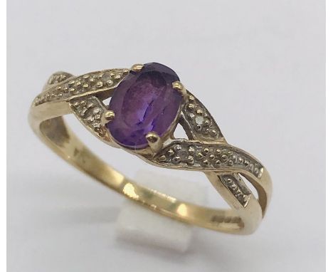 A 9ct gold dress ring set with amethyst and diamonds