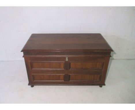 A mahogany storage trunk, with brass handles. Length 108cm, height 63cm.