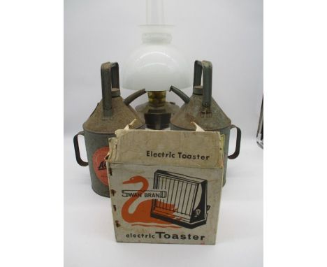 An assortment of vintage items including a brass oil lamp along with two Aladdin Pink paraffin cans, one is also marked Esso 
