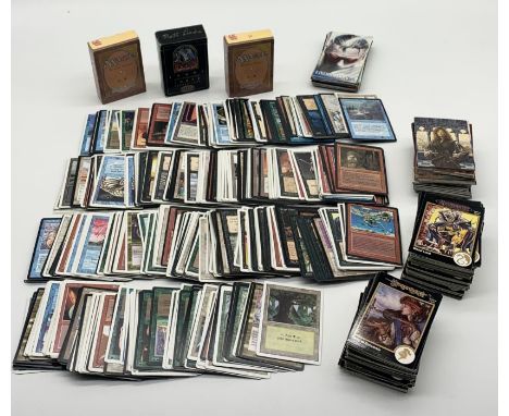 A large collection of Magic the Gathering playing cards including two revised edition starter pack boxes full of cards, 1999 