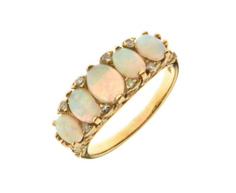 Five stone opal ring, stamped '18ct', with single cut diamond points between, size R, 5.9g gross   Condition: No obvious sign