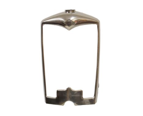 Chrome car radiator grille belonging to a 1930's Riley black saloon motor car, retaining Riley car badge to front along with 