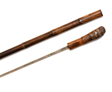 Antique sword-stick in a bamboo sheath, the hilt formed partly from the bamboo root with straight four-sided blade marked Sol