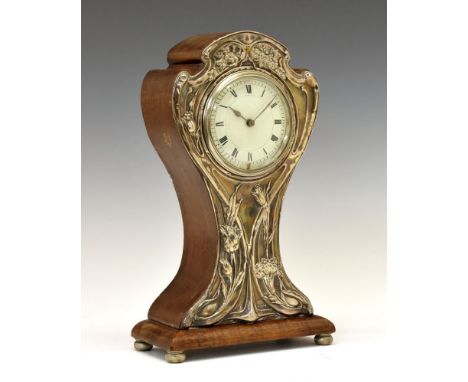 George V Art Nouveau style mahogany and silver fronted mantel clock, the decorative front panel having stylised embossed flow