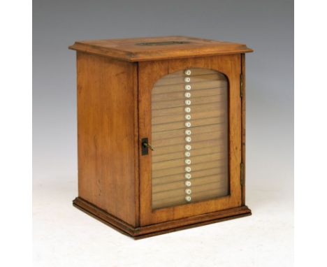 Early 20th Century mahogany table cabinet, fitted twenty shallow drawers, nineteen of these with numbered handles, enclosing 