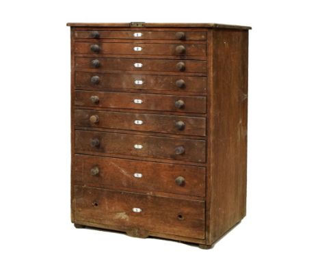 Late 19th Century French oak cabinet, of nine graduated drawers with enamel numbered plaques containing a good selection of g