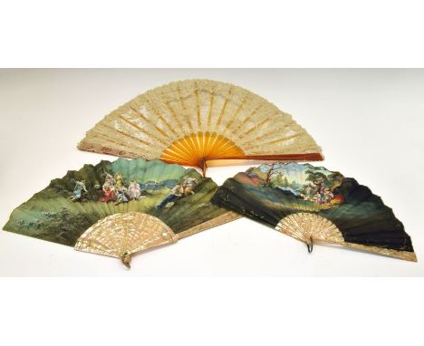 Two late 19th/early 20th Century watercolour-decorated silk fans, the first depicting Cupid and a gathering of maidens in an 