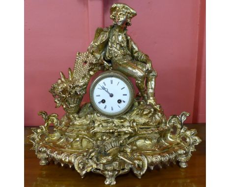 A French Louis XV style gilt metal mantel clock