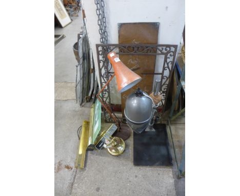 An orange angle poise lamp, brass desk lamp, metal frame, etc.