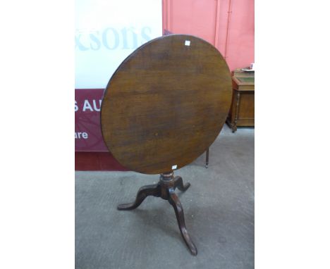 A George III oak circular tilt-top tripod table