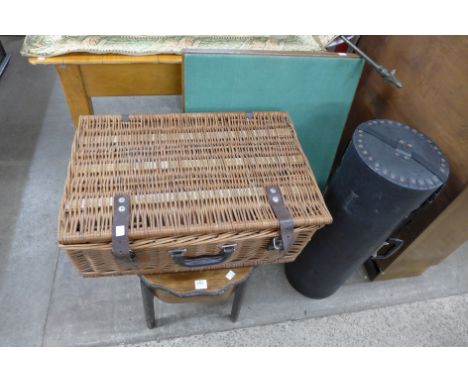 A sewing box, card table, wicker basket and a map holder