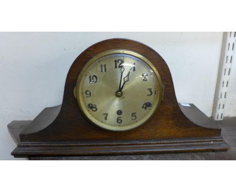An oak mantel clock