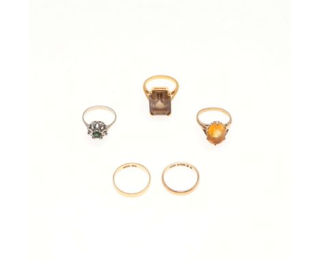 mounted with an oval-shaped citrine in 9ct gold, 3.6 grams, size K, together with another citrine single stone ring, the rect