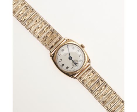 the signed circular dial with Arabic numerals and subsidiary seconds dial, on a 9ct gold textured link bracelet with ladder c