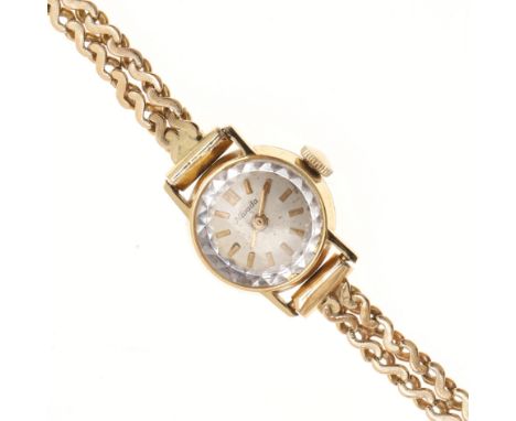 the signed circular dial with baton numerals, on a fancy link 18ct gold bracelet with ladder clasp, 16cm long, 15 grams. *CR 
