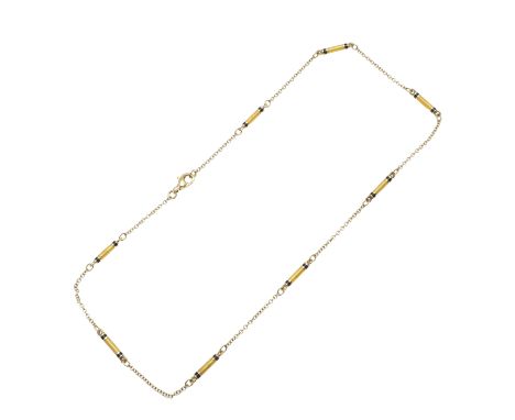 mounted with sections of yellow guilloche enamel with black enamel borders on an 18ct gold chain, maker's initials S.B, 45.5c