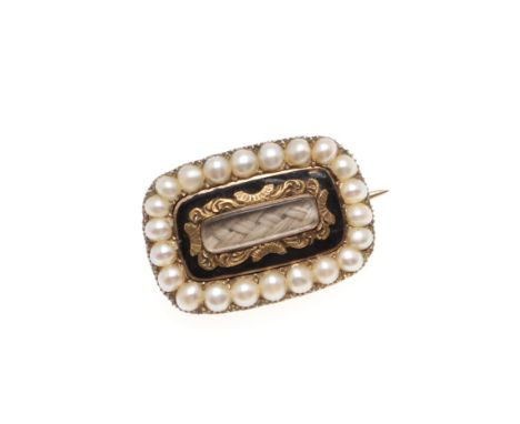 the centre section containing hair is set with a black enamel surround with gold decoration within an outer border of half pe
