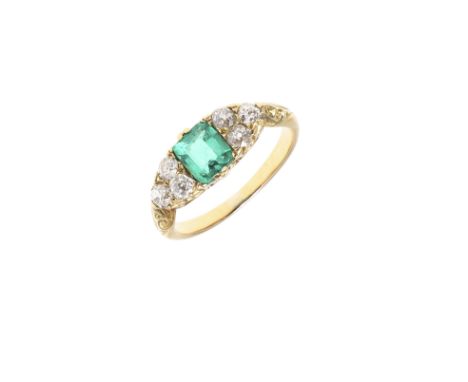 the rectangular-shaped emerald is set with three circular old-cut diamonds to each shoulder, in yellow gold, 3.1 grams. Size 