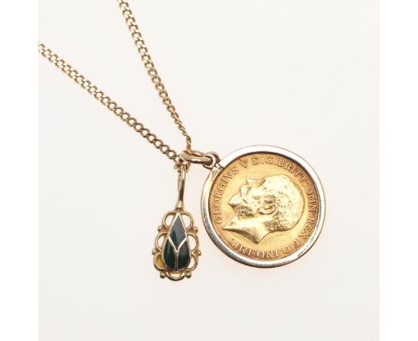 1913, in a 9ct gold pendant mount, suspended from an 18ct gold flat curb link chain, suspending a 14ct gold pendant set with 