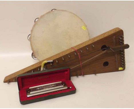 Hohner super chromonica harmonica in a bowed psaltery and a tambourine. Condition report: see terms and conditions