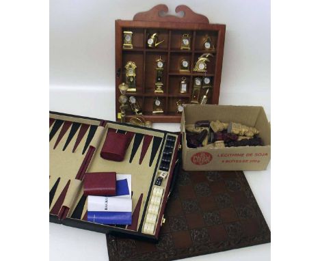 Chess set, games box and a collection of miniature brass clocks. Condition report: see terms and conditions