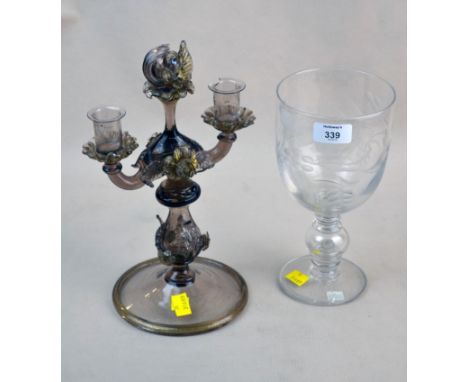 A Venetian glass twin branch candelabra, gilded detail, dolphin finial, raised on domed circular foot, 30cm (12in) high, toge