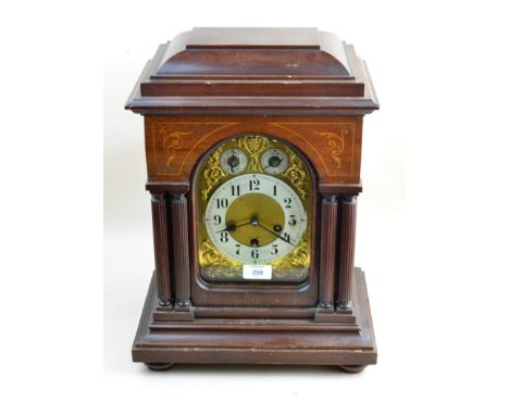 A c.1900 Junghans three-train mantel clock, the mahogany architectural case with inlaid decoration, the 8-day movement striki