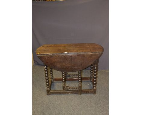 A 17th century oak gate-leg table