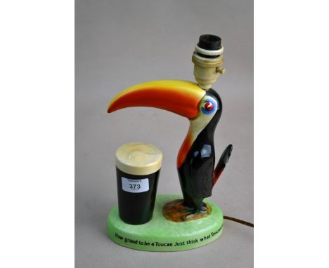 A Guinness Carltonware toucan lamp numbered G.A. 2178