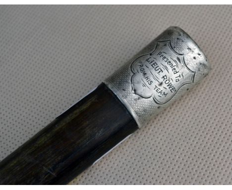 A silver mounted swagger stick, inscribed 'Presented to Lt. Rowe, by his Team', London marks