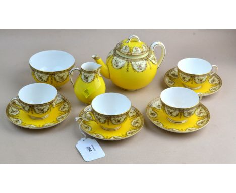 A Royal Worcester tea service, comprising pot, cream, sugar, four cups and saucers, each floral transfer decorated on a lemon