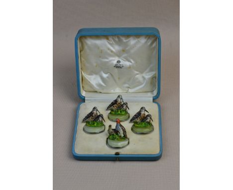 A set of four cold painted bronze, onyx and chrome game bird name place holders, by Asprey & Co in fitted box of issue