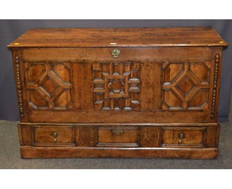 A late 17th century/early 18th century geometrically moulded mule chest, with applied split bobbin decoration above a single 