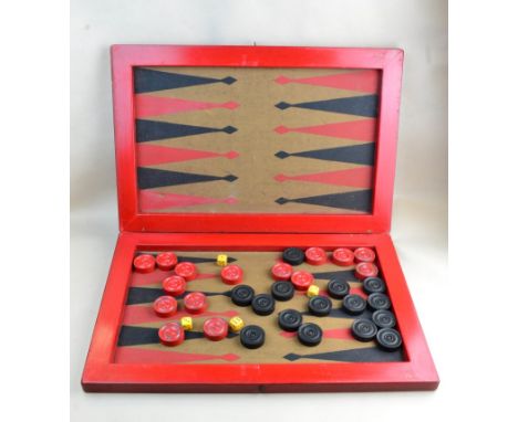 A red painted backgammon board and pieces.