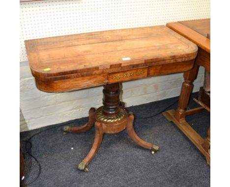 A Regency rosewood and brass strung card table