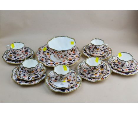 A late 19th century Coalport tea service, comprising six cups, saucers, tea plates, cake plate and slop, each of wrythen form