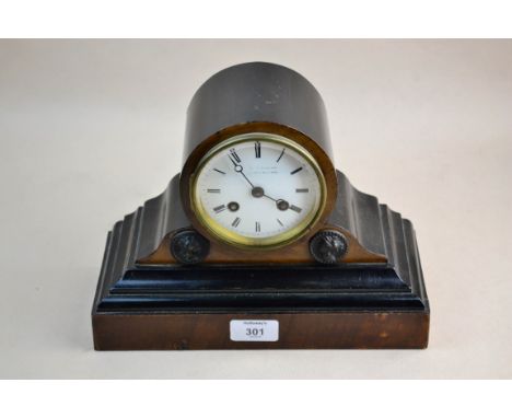 A Victorian ebonised drum form mantel clock