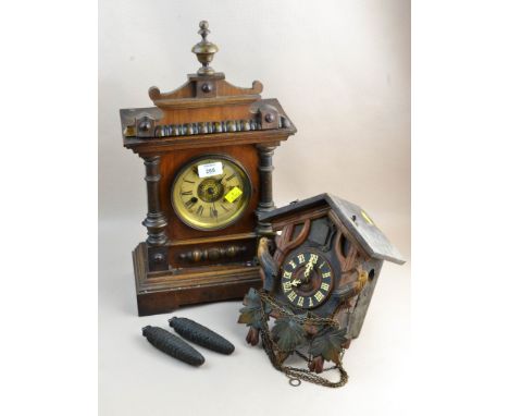 A late 19th century German mantel clock, the walnut case enclosing a fourteen day gong striking movement, together with a Bla