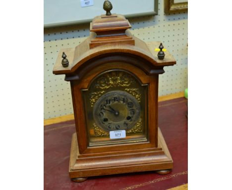 A late 19th century German walnut mantel clock