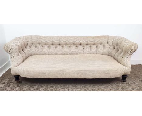 CHESTERFIELD SOFA, Victorian ebonised, circa 1890, in cream cord fabric on brass casters, 67cm H x 201cm W x 85cm D. 