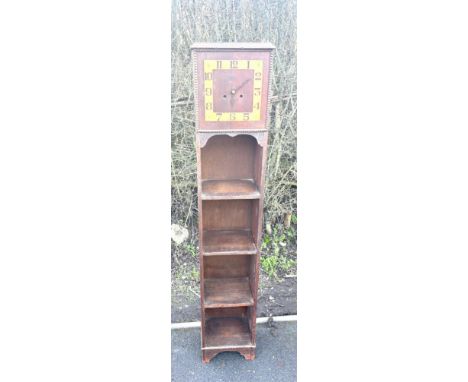Vintage battery operated clock book case, approximate measurements Height 60 inches, Width 11.5 inches, Depth 8.5 inches