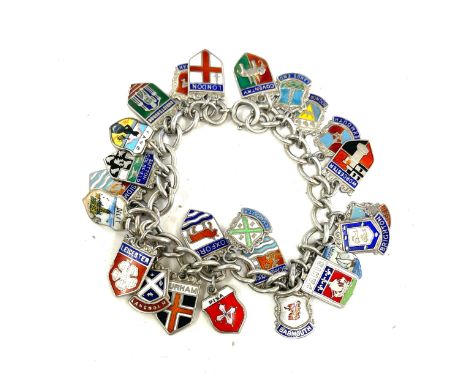 Silver charm bracelet, enamel shields, weight approximately 49g