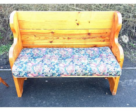Vintage pine pew with a padded floral cushion measures approx 39.5 inches tall 50.5 inches wide and 21 inches deep