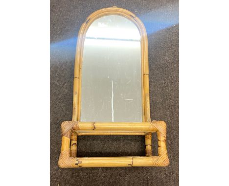 Cane wall mirror with shelf, approximate measurements: Height 31 inches, Width 14.5 inches, Depth 12 inches